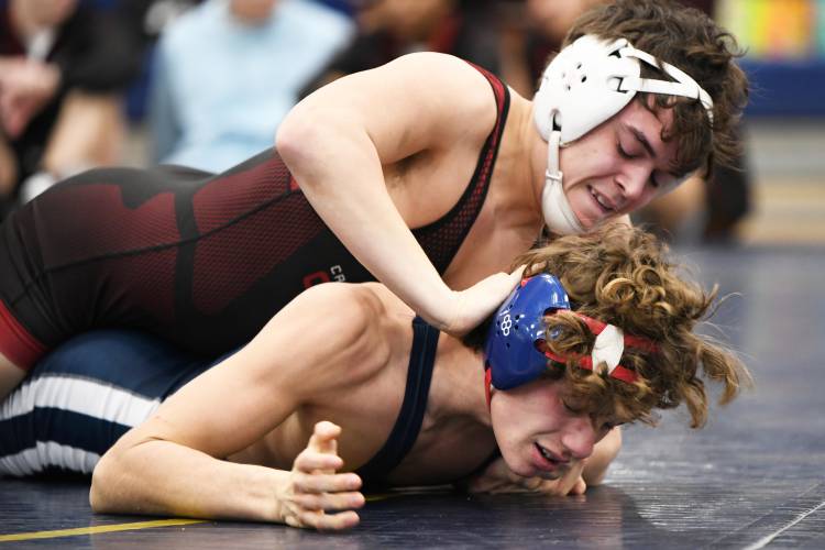 Concord’s Sawyer McCready pins Milford’s Kyle Lajoie during a dual meet on Saturday at Windham High School. The Tide swept all three of its duals.