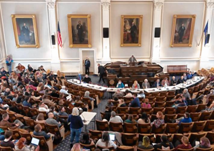 New Hampshire residents gather to testify on House Bill 619 at the Statehouse in Concord last March. An amended version of the bill, which passed the house last month, would ban gender-affirming surgeries for minors, but no New Hampshire hospitals have said they currently provide such procedures.