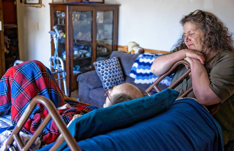  Jessica Helfenstein smiles down at John Jones in their home in Franklin on April 25, 2024.
