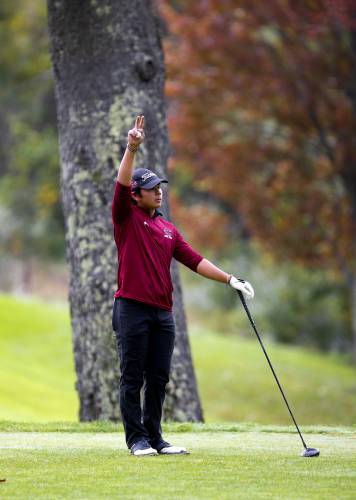 Concord golfer Carl Sirrianna signals to the group ahead at last year’s Division I championship at Canterbury Woods on Oct. 10, 2023. Sirrianna, a senior, is back to help the Tide defend its title.