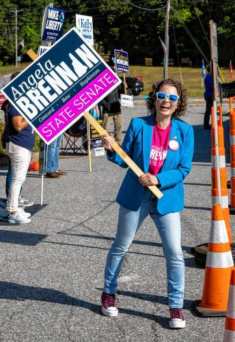 Candidate Angela Brennan of Bow stands in the line outside the voting polling place in Bow on Tuesday morning, September 10, 2024. Brennan is running in the democratic primary for the State Senate District 15 seat.