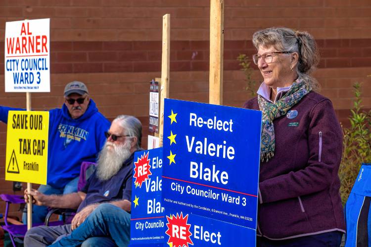 Valerie Blake, who is tied with Al Warner for Ward 3 in Franklin, greeted voters outside the Franklin Middle School on Tuesday.