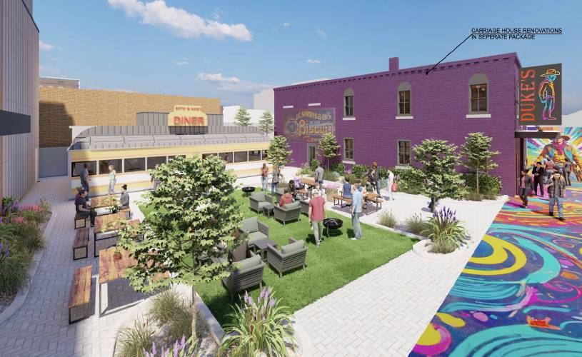 Renderings from a new proposal for the Arts Alley development show the reduced size of its building on South Main Street — down to two floors with a roof deck — and the addition of a restored antique, galley-style diner to its footprint. 