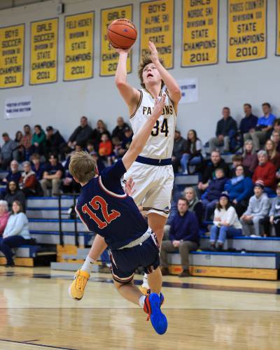 Bow’s Jake Reardon goes up for a shot against Plymouth during a game at Bow High School on Feb. 15. Reardon, an All-State player, is back to lead the Falcons this season.