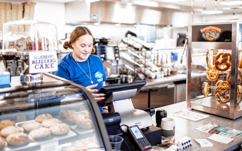 Amber Dennis Proulx on her first day of work at the new Common Man Roadside Market and Deli at the Epsom Circle on Tuesday, January 2, 2024.