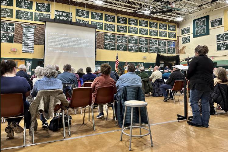 Laurie Pappas argues in favor of vote-counting machines in Hopkinton, N.H., on Thursday, March 21, 2024. Hopkinton was one of more than 20 towns that rejected such measures this month. Only one town voted to return to hand-counting of ballots, but the secretary of state says the decision is unlikely to stand. (AP Photo/Holly Ramer).