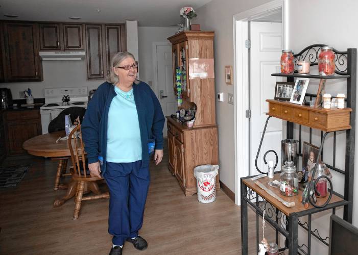 Marlene Sheehan in her two bedroom apartment at Penacook Landing on Canal Street in downtown Penacook on Wednesday, April 3.