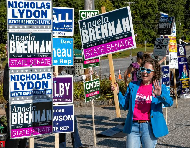 Candidate Angela Brennan of Bow stands in the line outside the voting polling place in Bow on Tuesday morning, September 10, 2024. Brennan is running in the democratic primary for the State Senate District 15 seat.