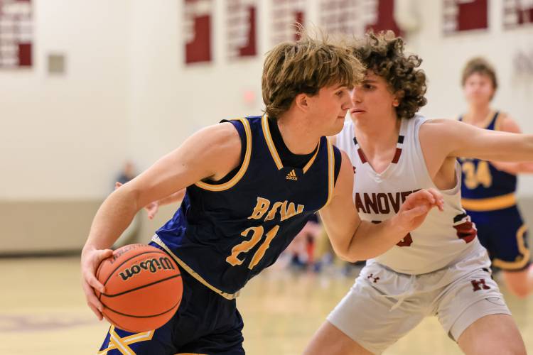 Bow’s Peyton Larrabee drives toward the basket in last year’s Division II boys’ basketball quarterfinal against Hanover on March 1. Larrabee is back to help lead the Falcons this season.