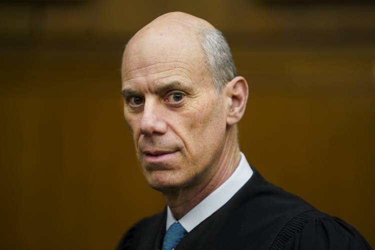 FILE - U.S. District Judge James Boasberg, chief judge of the United States District Court for the District of Columbia, stands for a portrait in Washington. He has faced calls for impeachment since deeming lawyers’ defense of the expulsion of Venezuelan migrants to El Salvador “woefully inadequate.” (Carolyn Van Houten/The Washington Post via AP, File)