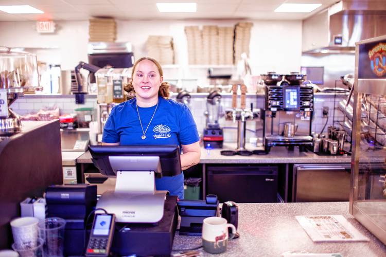 Amber Dennis Proulx on her first day of work at the new Common Man Roadside Market and Deli at the Epsom Circle on Tuesday.