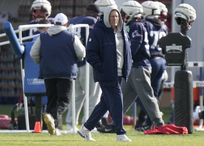 New England Patriots head coach Bill Belichick walks on the field during an NFL football practice, Nov. 15, 2023.