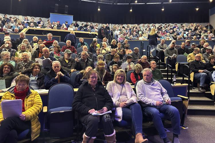 A crowd of more than 500 gathers at the Inter-Lakes Middle/High School for the annual Meredith Town Meeting on March 13, 2024, in Meredith, N.H. An orchestrated effort to get rid of vote-counting machines from dozens of towns and return to hand-counting elections has failed. Just a single town opted to return to hand counts in a single race, the presidential election, in a decision that both the town's attorney and the secretary of state say is unlikely to stand. (AP Photo/Nick Perry)