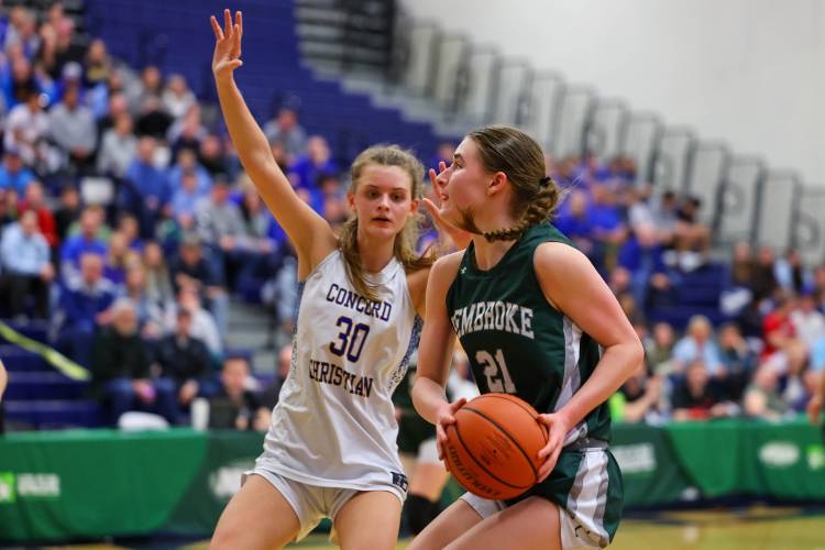 Concord Christian’s Emma Smith defends against Pembroke’s Annelise Dexter during last year’s Division II girls’ basketball championship game at UNH on March 10. Concord Christian won its third consecutive in its third different division and will now take on Division I. Smith, a 1,000 point scorer and Second Team All-State player, is back to help lead the Kingsmen this season.