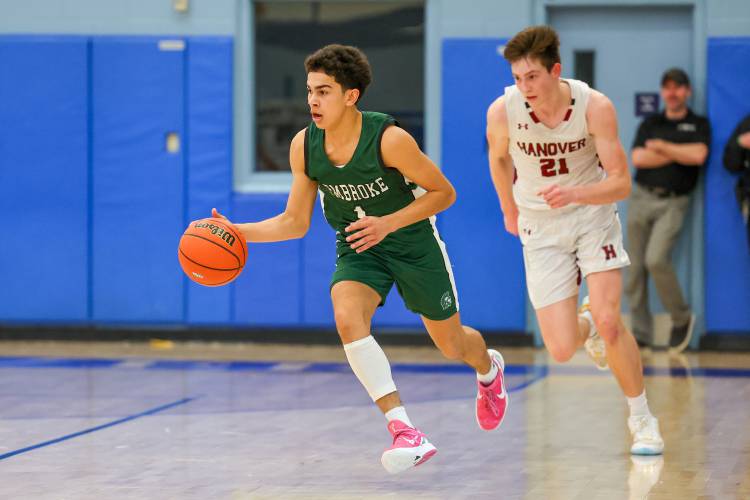 Evan Berkeley dribbles the ball up the floor for Pembroke against Hanover in last season’s Division II semifinal. Berkeley and teammate Devin Riel will be co-captains for the Spartans this season.