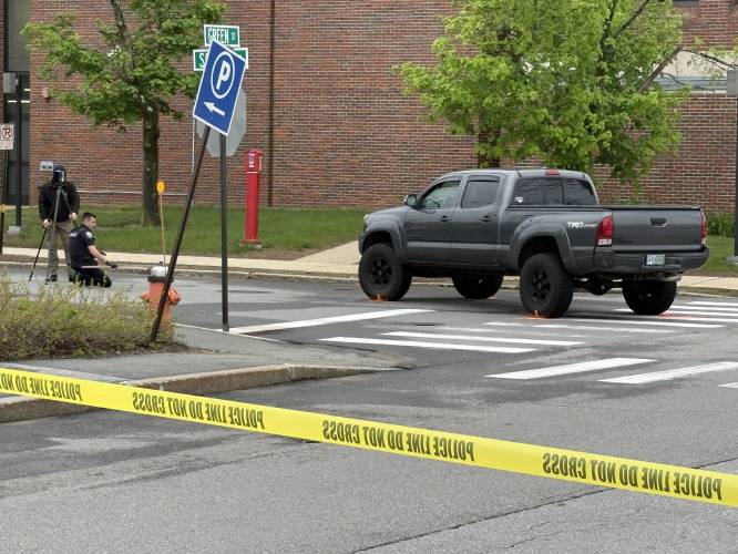 A gray Toyota Tacoma was near the scene of  a vehicle versus pedestrian accident at Green and School streets Friday.