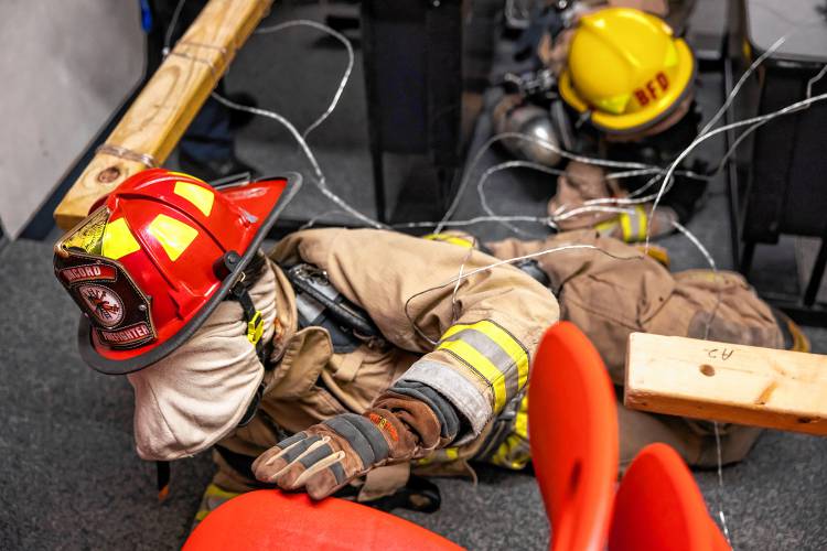 Addison “Nails” Bergeron leads the group through the obstacle course at their CRTC firefighter class at Concord High School.