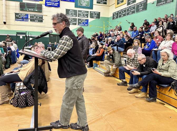 Don Vickery argues against getting rid of vote-counting machines in Hopkinton, N.H., on Thursday, March 21, 2024. Hopkinton was one of more than 20 towns that rejected such measures this month. Only one town voted to return to hand-counting of ballots, but the secretary of state says the decision is unlikely to stand. (AP Photo/Holly Ramer)