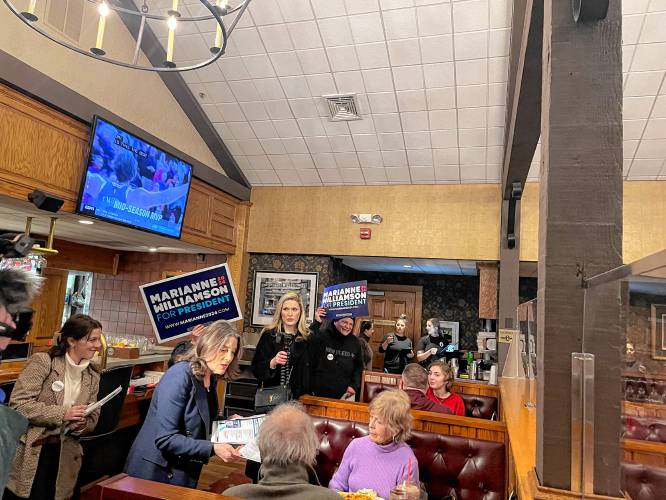 Marianne Williamson greeted voters at Puritan Backroom on Friday. 