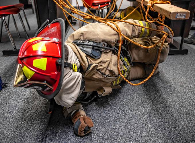 Addison “Nails” Bergeron leads the group through the obstacle course at their CRTC firefighter class at Concord High School on Thursday, March 7, 2024.