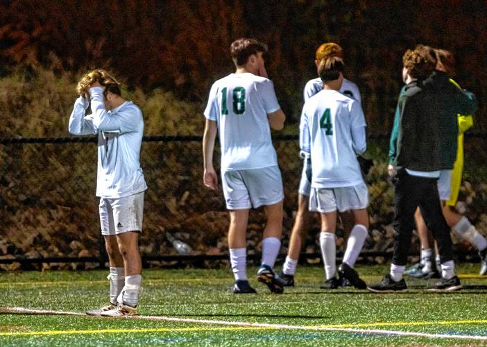 The Hopkinton boys soccer team react after losing in penalty kicks after two overtime periods during the D-III semifinals at Laconia High School on Monday, October 30, 2023.