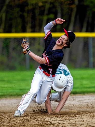 Belmont shortstop Max Ryder gets pushed off second base by Monadnock base runner Ben Dean on a force play on Monday, May 13, 2024. Dean was called out to end the inning.