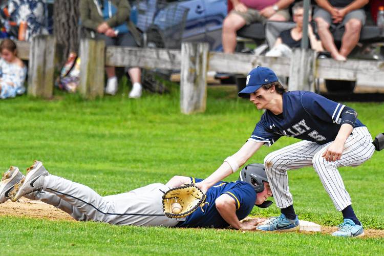 Merrimack Valley’s Jonas Weed (5) attempts to tag out a ConVal runner during a game in Penacook on Tuesday. MV beat ConVal, 4-2.