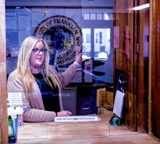 LEFT: Franklin City Clerk Michelle Stanyan, shown in the city hall office in February, is responsible for tax collection and the home-deeding process.
