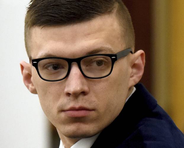 FILE - Volodymyr Zhukovskyy looks back at the gallery before closing statements at his trial at Coos County Superior Court, in Lancaster, N.H., Aug. 9, 2022. Relatives and friends of seven motorcyclists who died in a 2019 crash urged New Hampshire officials Wednesday, June 19, 2024 during an emotional hearing not to allow the trucker back on the state's roadways. (David Lane/Union Leader via AP, Pool, File)