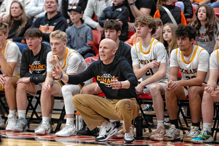 Conant head coach Eric Saucier reacts to a foul call in the second half of the NHIAA Division III boys' basketball state championship game last season. After 19 seasons on the Conant sideline, 16 of them as head coach, Saucier is taking over as head coach at Bow.