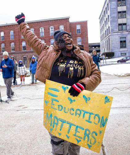 Sarah Georges of UNH Leadership Series urges the group of special education advocates to march around the State House after their rally at the State House on Tuesday, January 13, 2025.