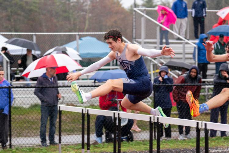 Merrimack Valley’s Mychal Reynolds races in the 110-meter hurdles at the Black Bear Invitational at Coe-Brown Northwood Academy on Saturday. Reynolds finished third in the 300 hurdles, sixth in the 110 hurdles and anchored MV’s third-place 4x400 relay to help the Pride win the Black Bear team title. MV topped a field of 29 teams.