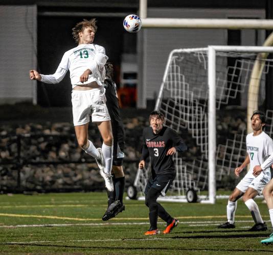 Hopkinton defender Abram Standefer re-directs a ball toward the goal during the second half of the D-III semifinals against Campbell on Monday night, October 30, 2023.