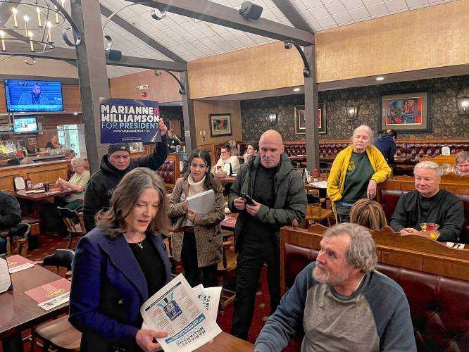 Marianne Williamson speaks with Tim Hardy, a Democrat who is hesitant to write in President Joe Biden’s name after he skipped campaigning in New Hampshire. Biden won’t appear on Tuesday’s ballot. 