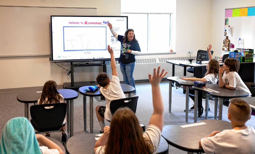 Allenstown Community School teacher Kim Foss asks a question to her class on the first day of school at the new facility on Friday, May 3, 2024.