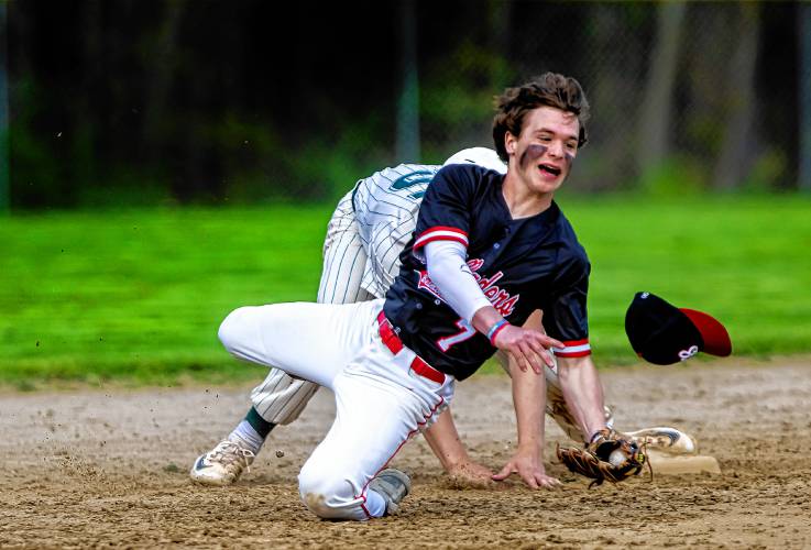Belmont shortstop Max Ryder gets pushed off second base by Monadnock base runner Ben Dean on a force play on Monday, May 13, 2024. Dean was called out to end the inning.