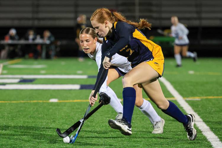 Bow sophomore forward Gianna Trott tries to dribble past Hollis-Brookline’s defense, which allowed the least amount of goals to opposing teams this season.