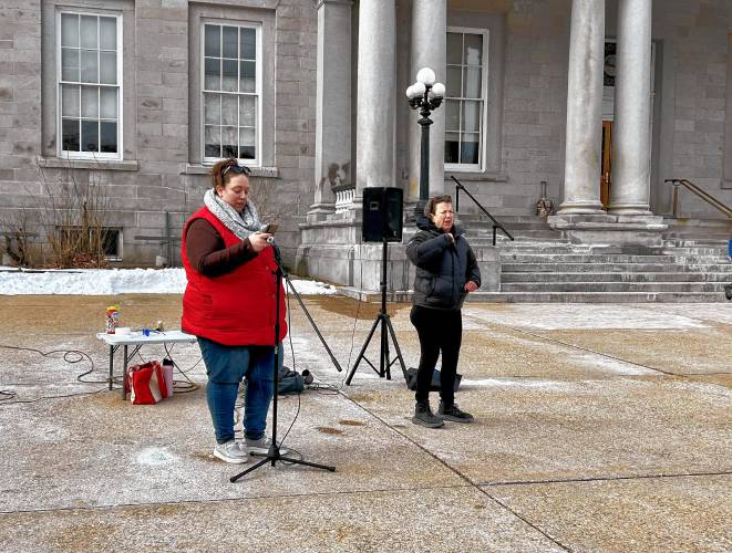 Amber MacQuarrie (left), joined by a sign language interpreter, said she supports and uses Education Freedom Accounts but believes school choice should extend to public school students who need special education.